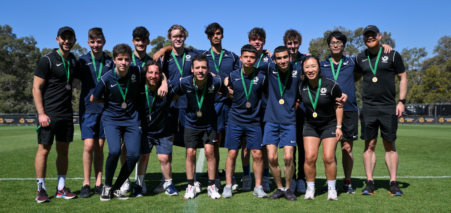 Victorian Para Football State team members posing for a group photo with their silver medals