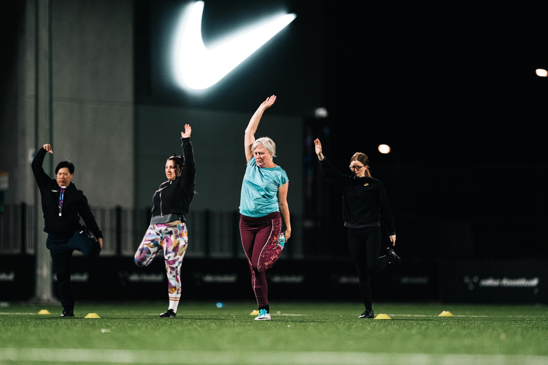 Women stretching on the Nike Pitch at The Home of The Matildas