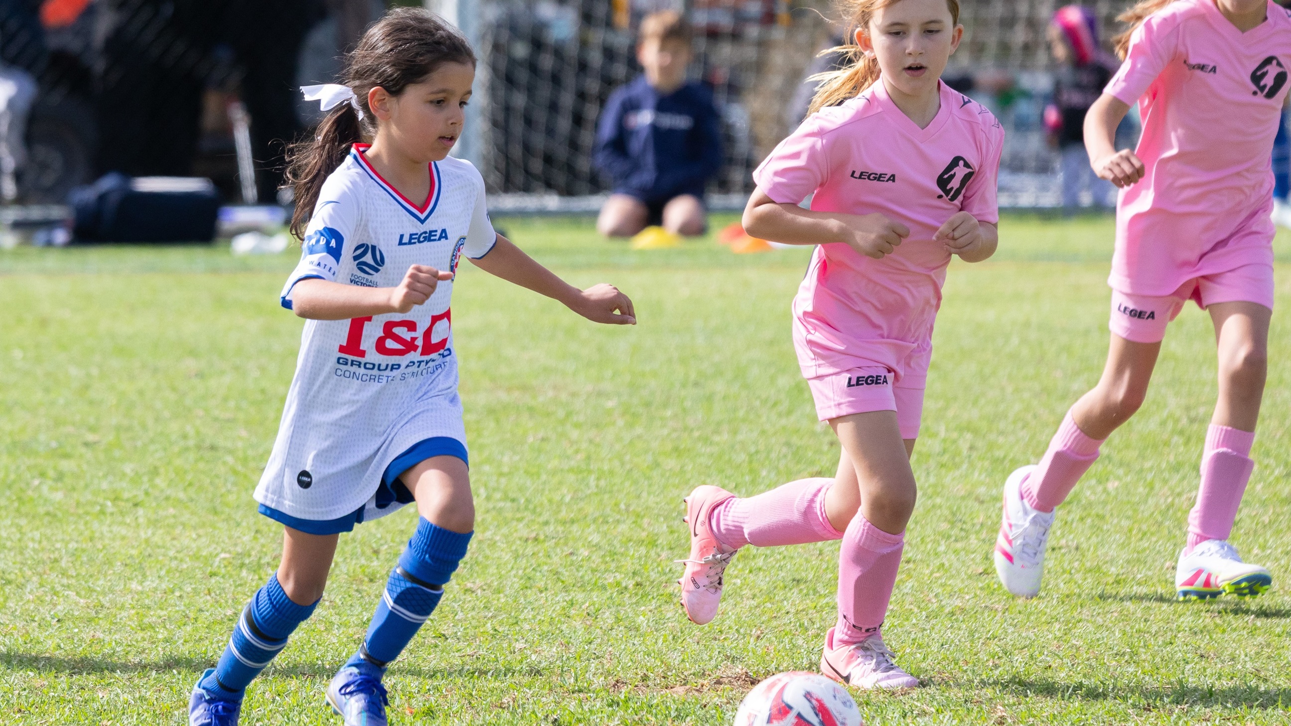 Girls playing football at the Dandy Cup