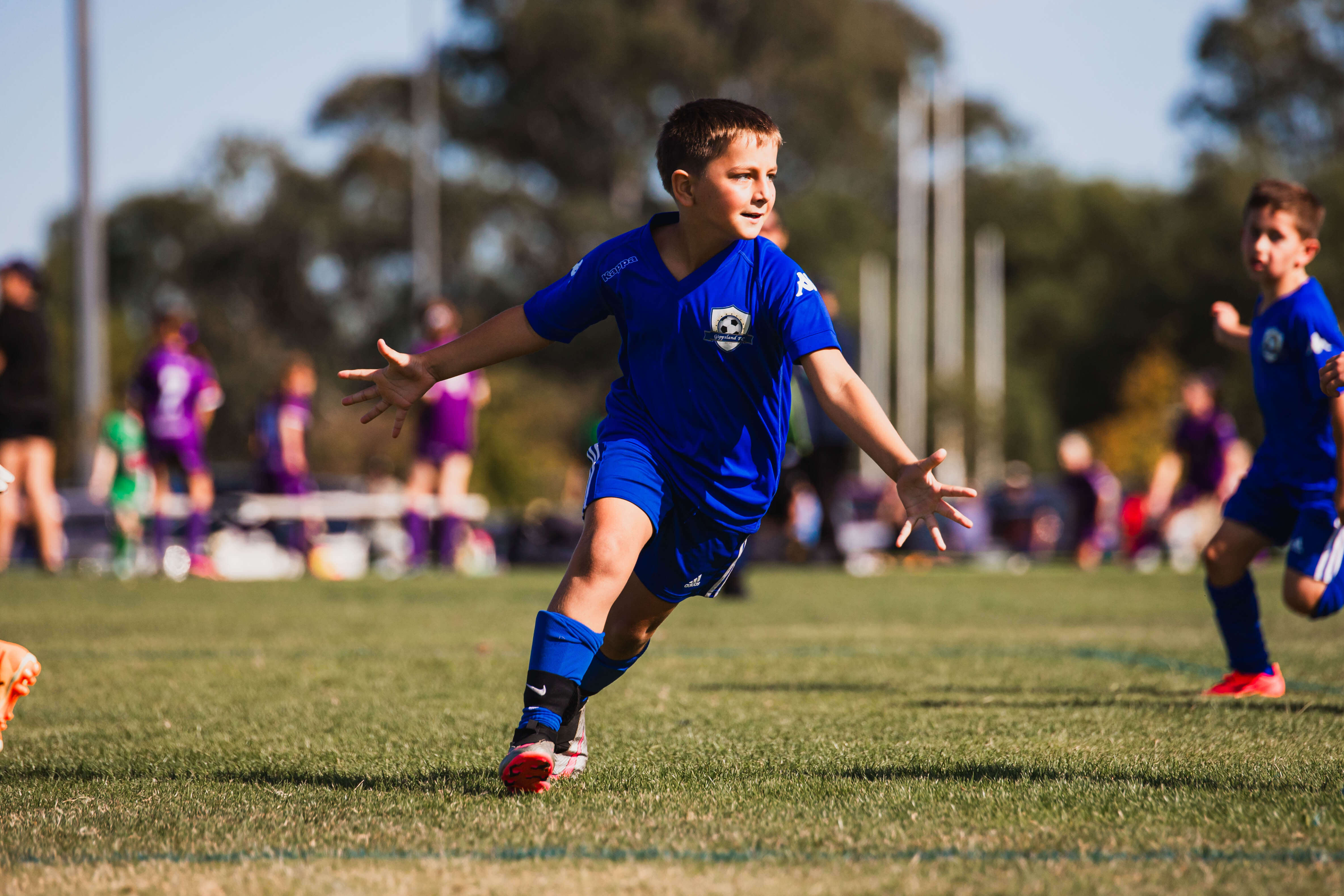 Young boy celebrating a goal