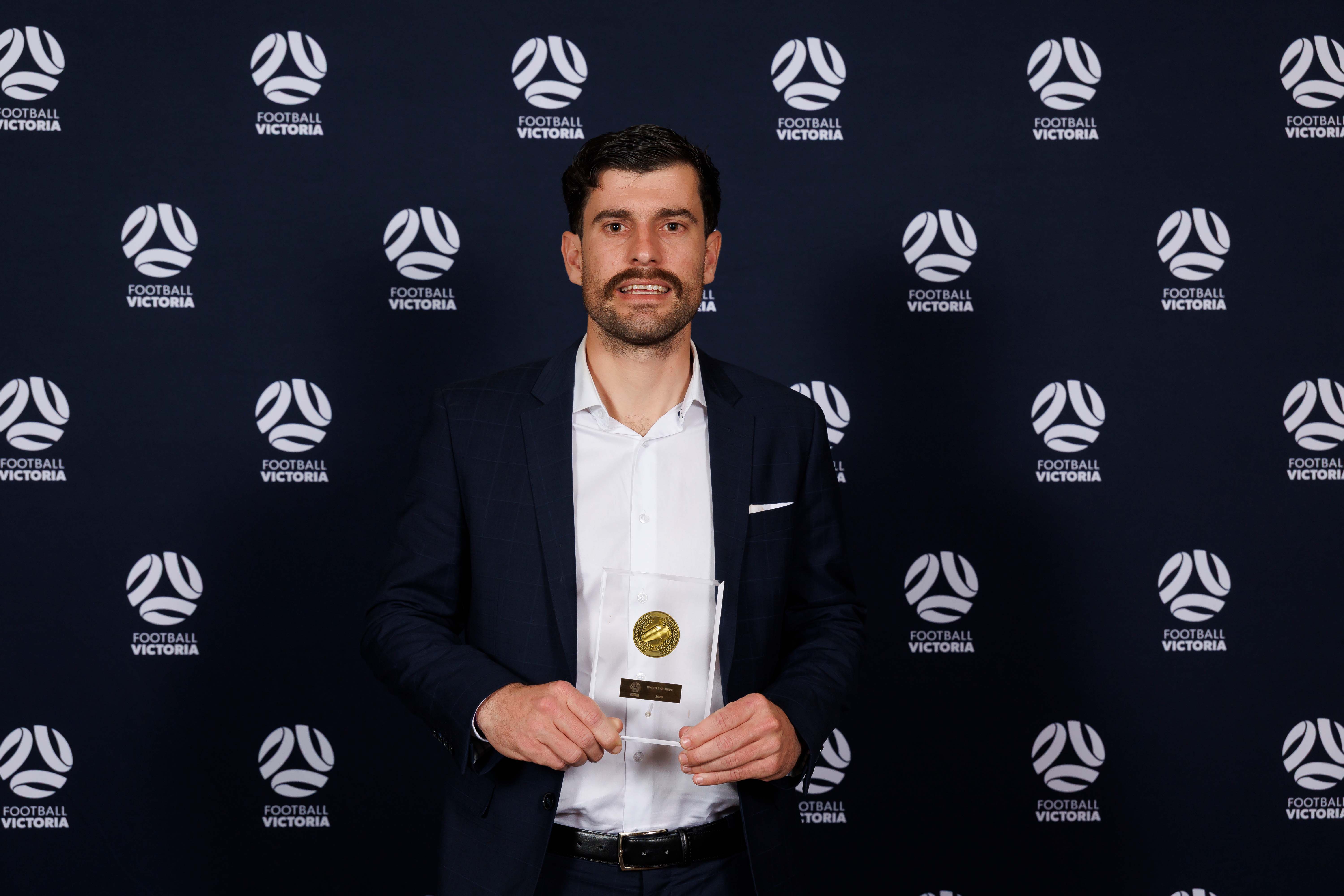 ryan scott with award