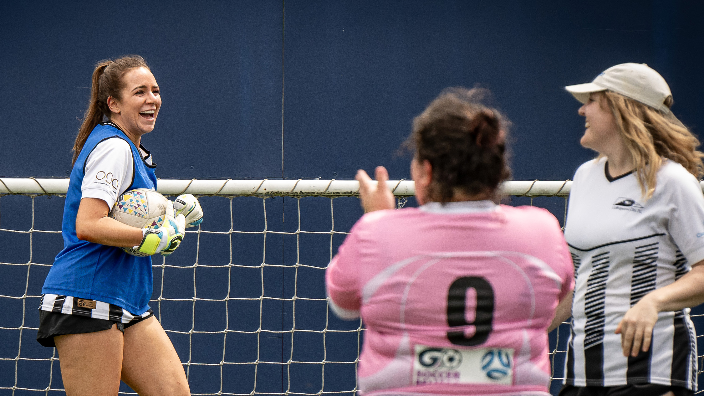 Women playing football at Go Soccer Mum's Cup, now called PlayHer Cup