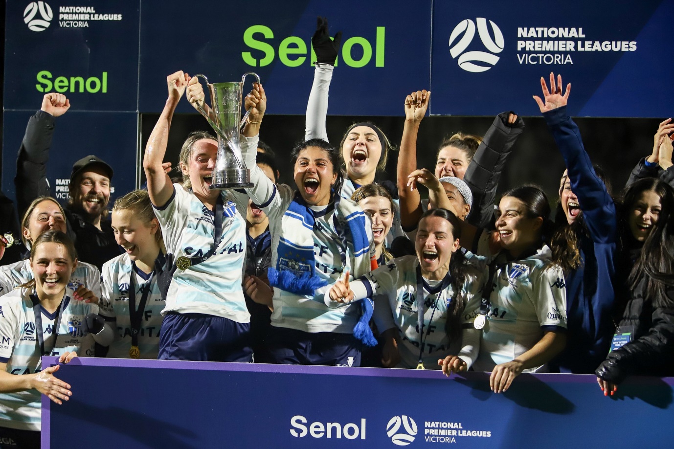 May be an image of 8 people, people playing soccer and text