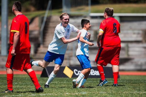 Two victorian players celebrating a goal