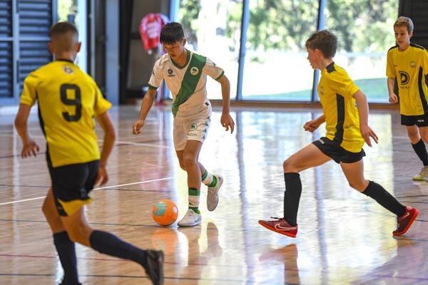 People playing futsal football