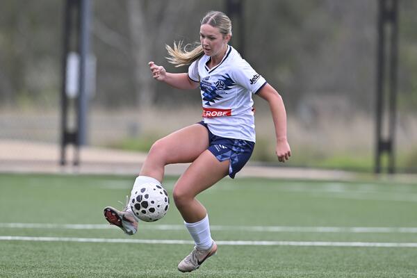 U16 Victoria White player in action 